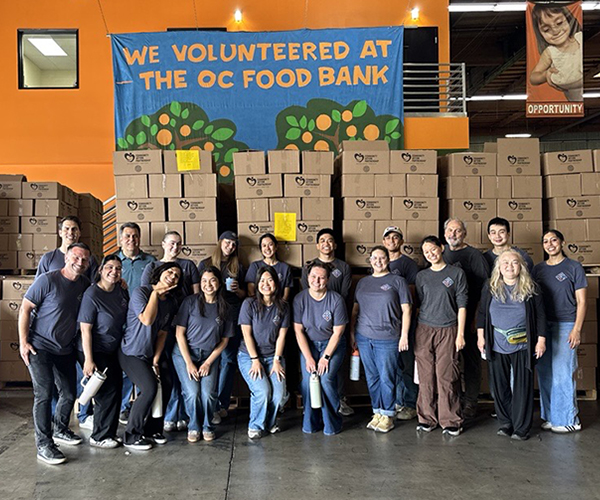 WNC staff volunteers at Community Action Partnership of Orange County's Pack a Box volunteer event