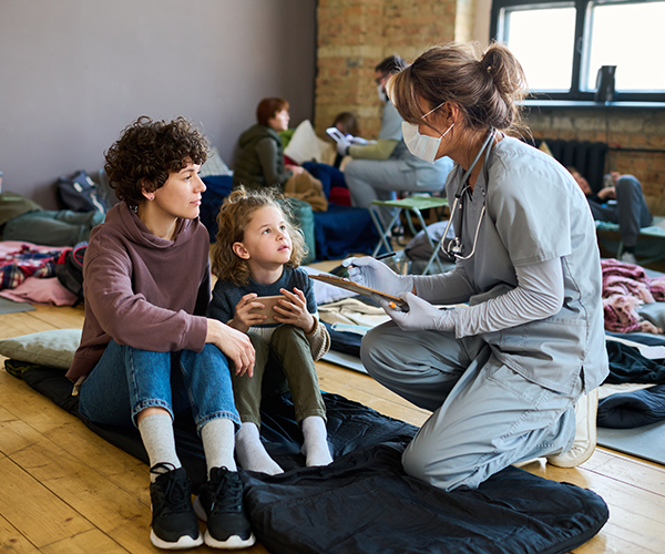Healthcare worker and family experiencing homeless